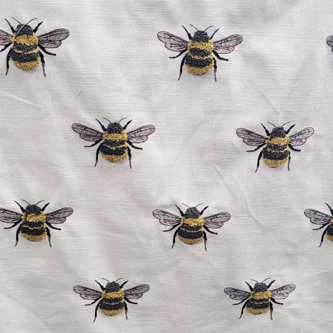 Embroidered bee fabric close up showing bee motif on Busy Bee Honey pattern