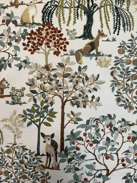 Woodland animal and tree motif on Enchanted Forest fabric in eucalyptus green