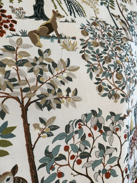 Woodland animal and tree motif on Enchanted Forest fabric in eucalyptus green