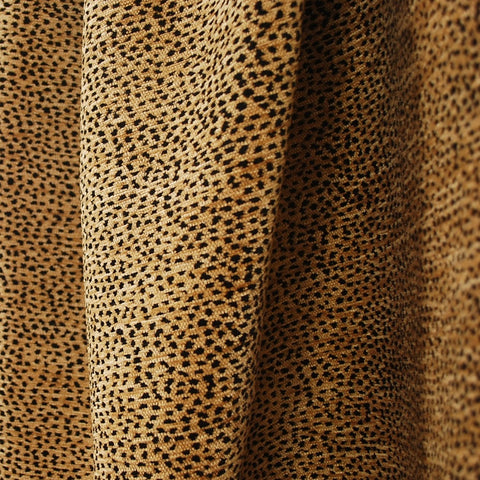 Designer upholstery textile in black and tan animal motif