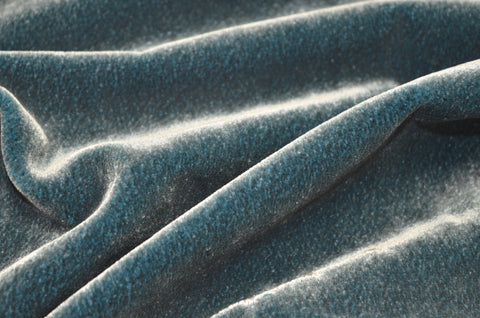 Close-up of blue velvet fabric with folds